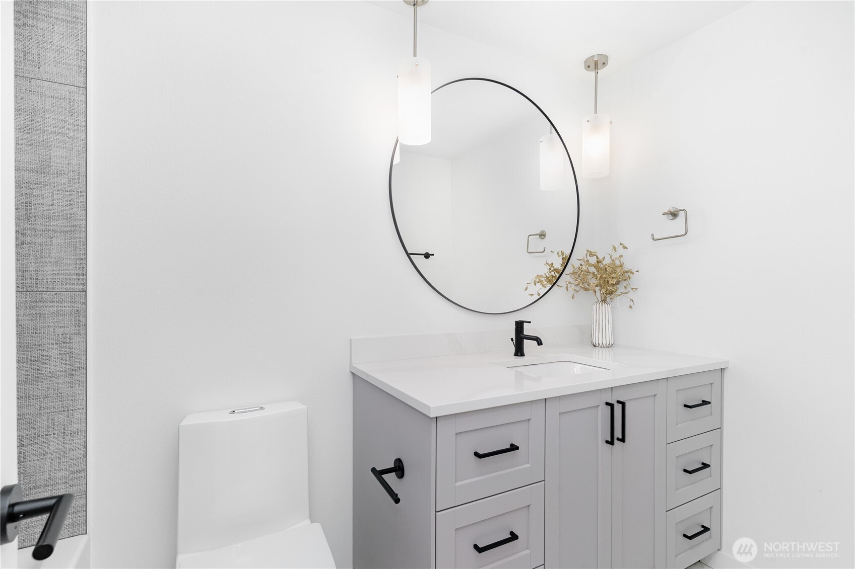 8428 Northeast 132nd Place Kirkland, WA 98034 - Photo 20 of 30 a bathroom with a sink a mirror and a shower curtain
