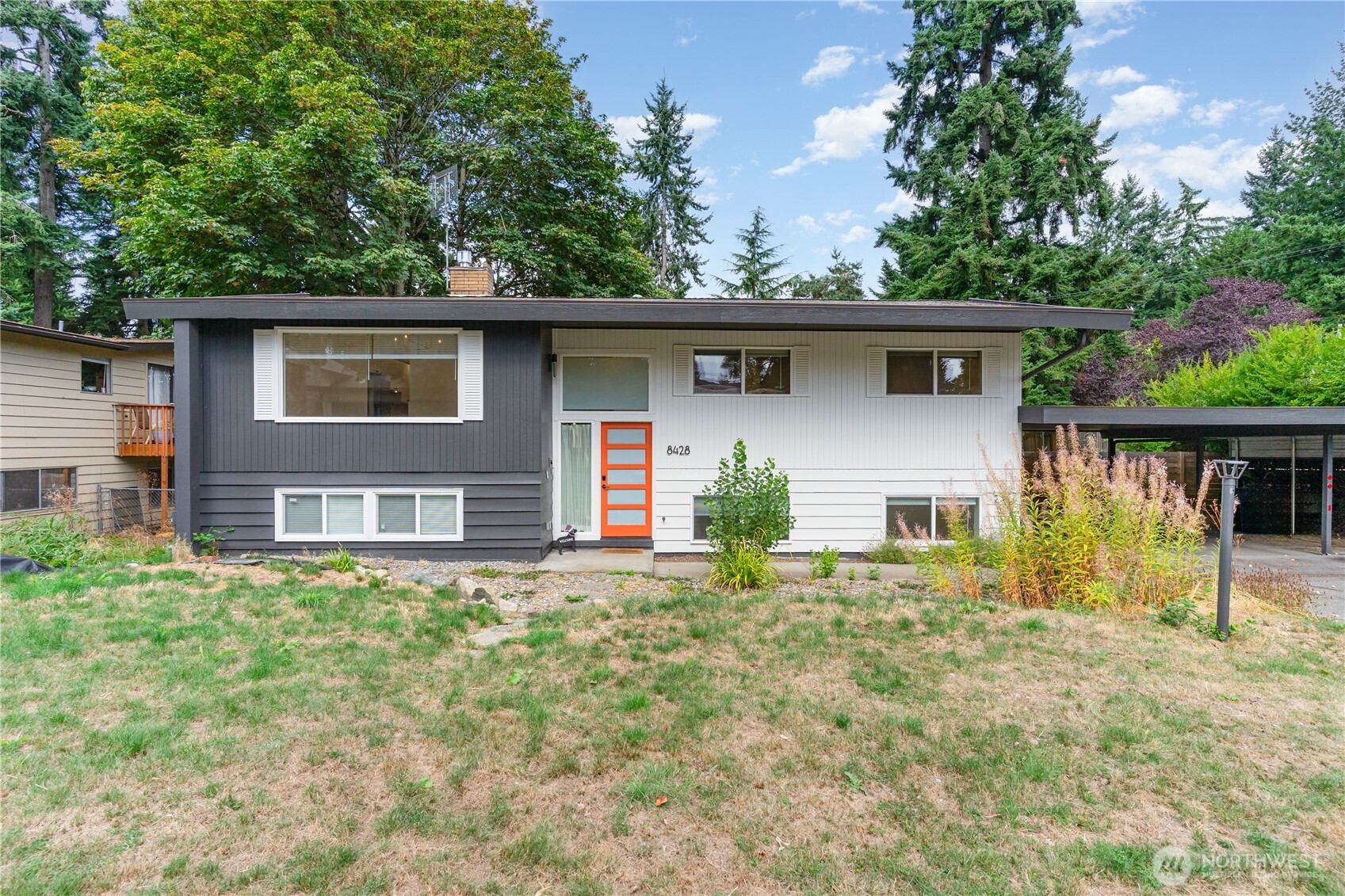 8428 Northeast 132nd Place Kirkland, WA 98034 - Photo 2 of 30 a house that has a tree in front of the house