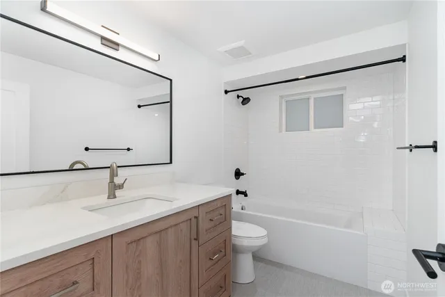 a bathroom with a sink toilet a vanity and shower