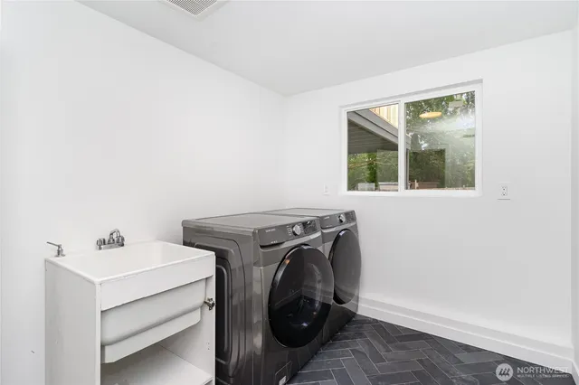 a utility room with dryer and washer