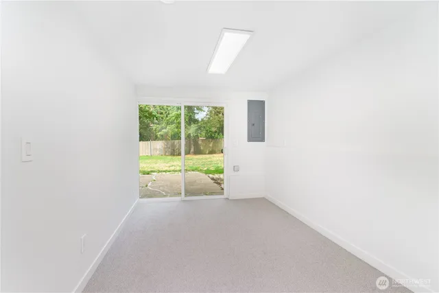 a view of an empty room with a window