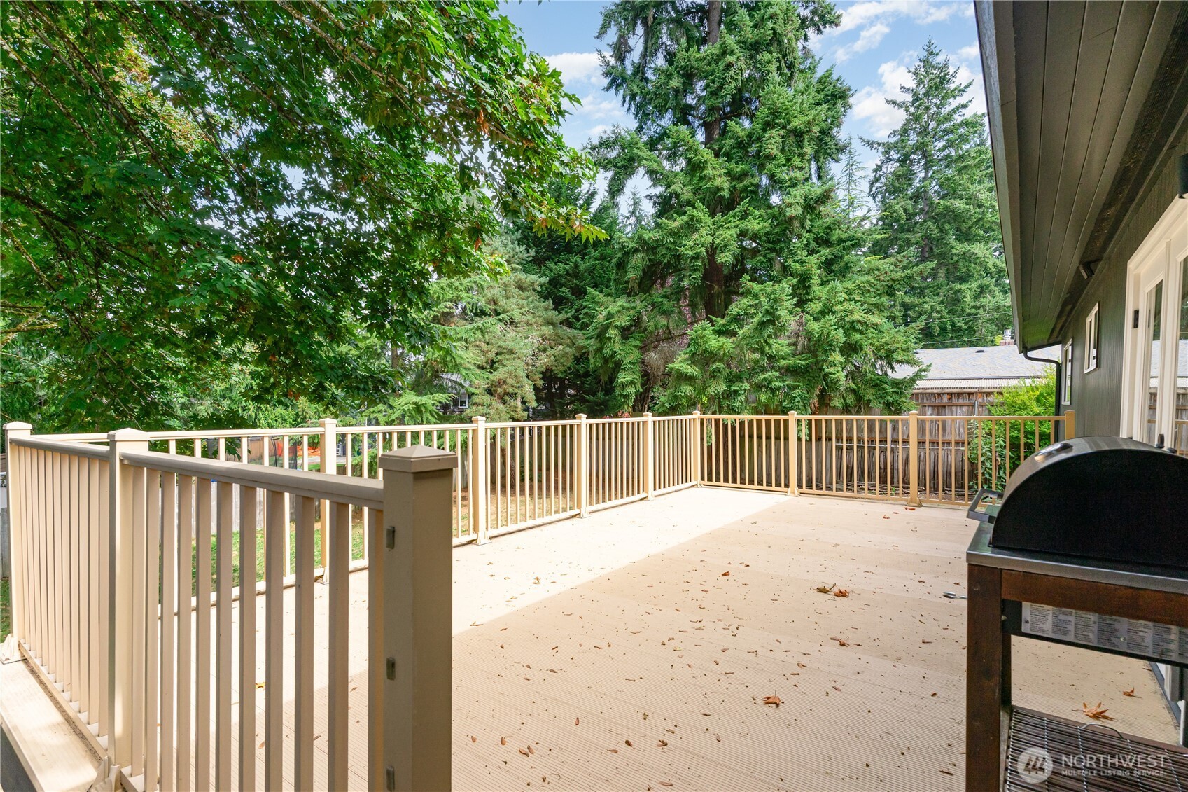 8428 Northeast 132nd Place Kirkland, WA 98034 - Photo 29 of 30 a balcony with trees in front of it