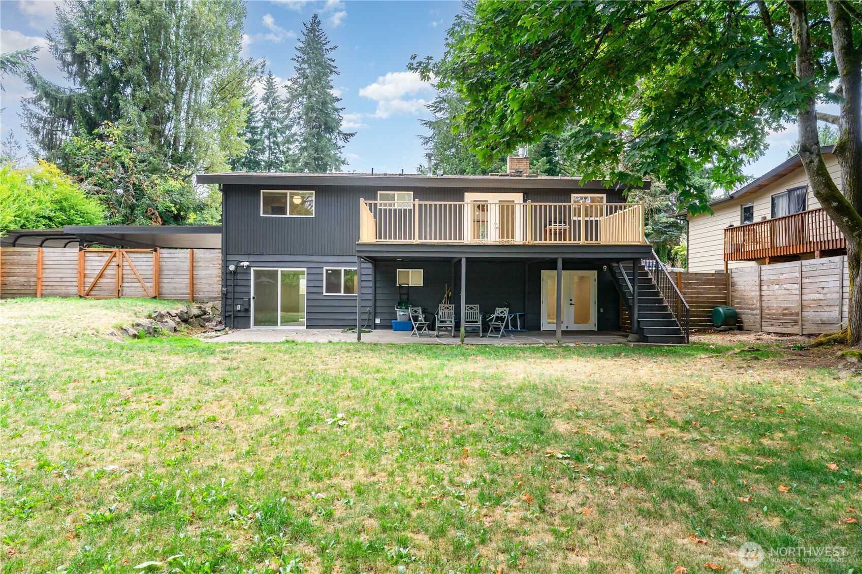 8428 Northeast 132nd Place Kirkland, WA 98034 - Photo 5 of 30 a front view of a house with a garden