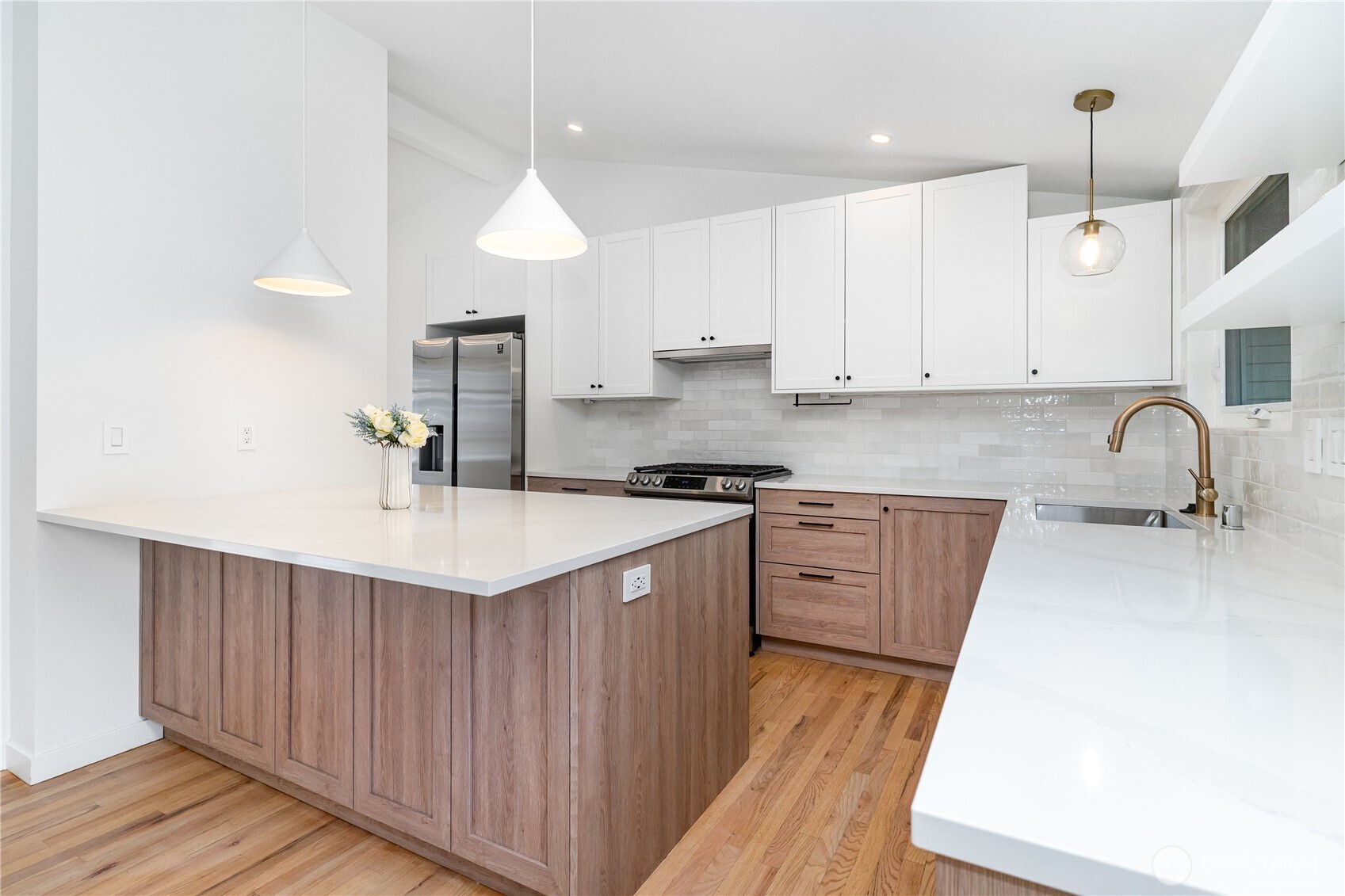 8428 Northeast 132nd Place Kirkland, WA 98034 - Photo 10 of 30 a kitchen with granite countertop a sink stove and cabinets