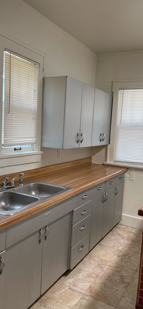 312 West Springfield Avenue Champaign, IL 61820 - Photo 3 of 5 a sink with cabinets