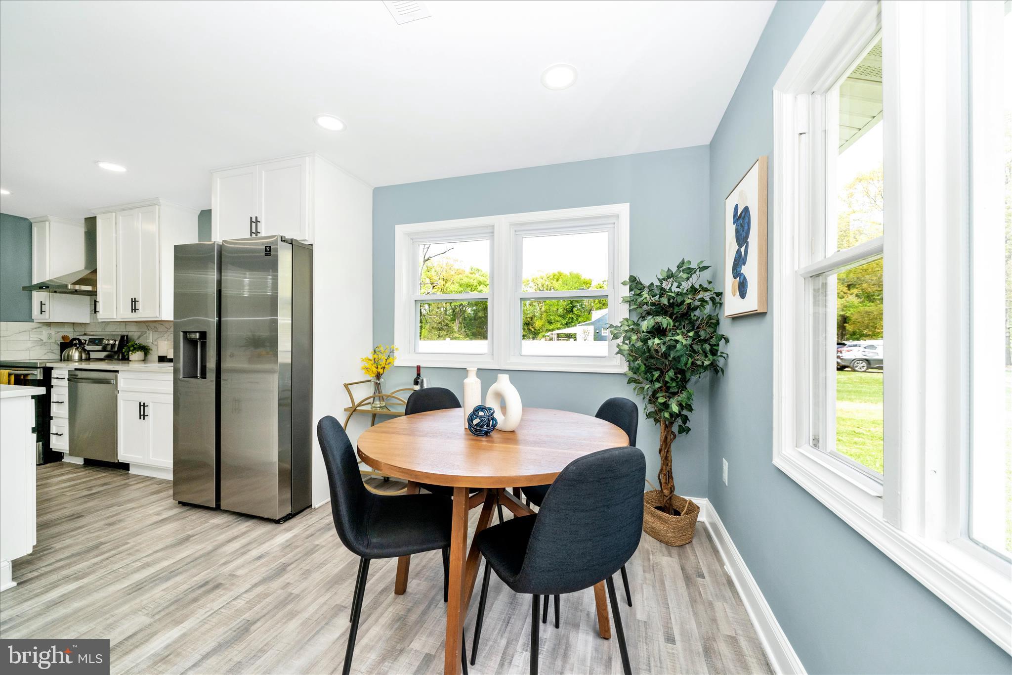 6737 Allentown Road Temple Hills, MD 20748 - Photo 22 of 51 a kitchen with a table and chairs in it