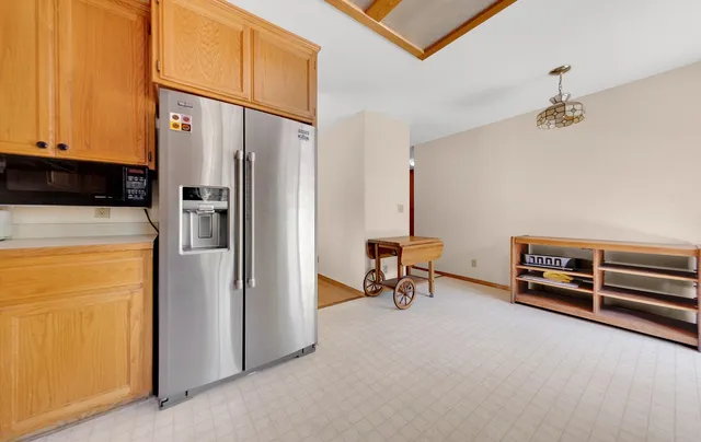 a view of a kitchen with appliances and cabinets