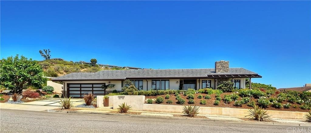 32732 Mediterranean Drive Dana Point, CA 92629 - Photo 1 of 24 a front view of a house with a yard
