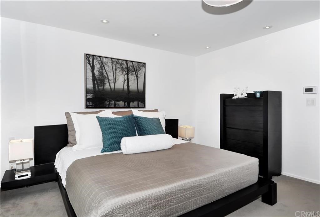 32732 Mediterranean Drive Dana Point, CA 92629 - Photo 13 of 24 a bedroom with a bed and a flat screen tv