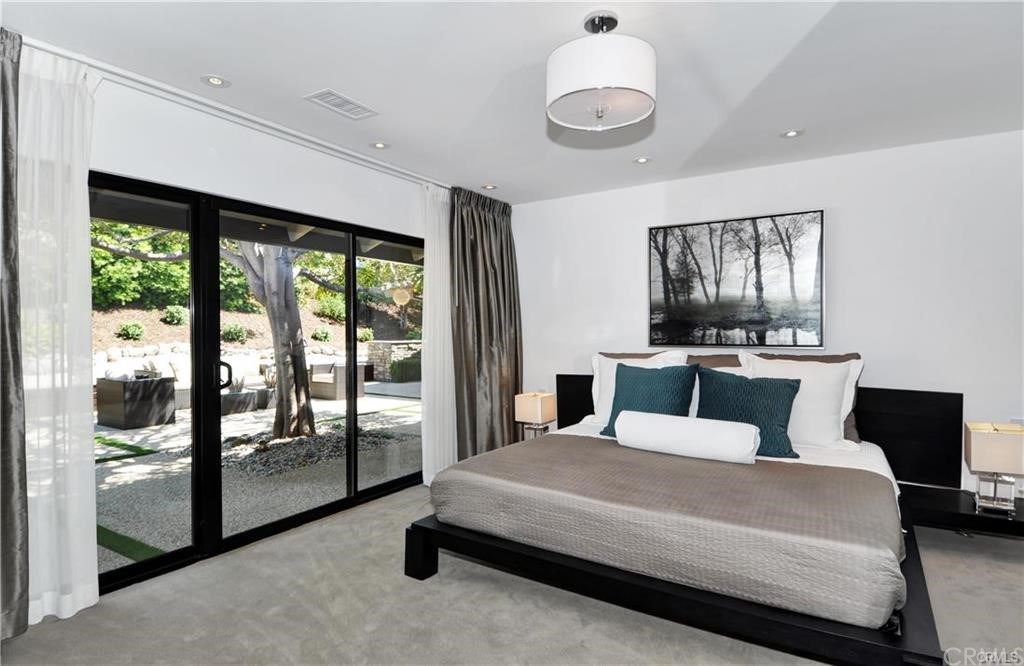 32732 Mediterranean Drive Dana Point, CA 92629 - Photo 14 of 24 a bedroom with a large bed and a balcony view