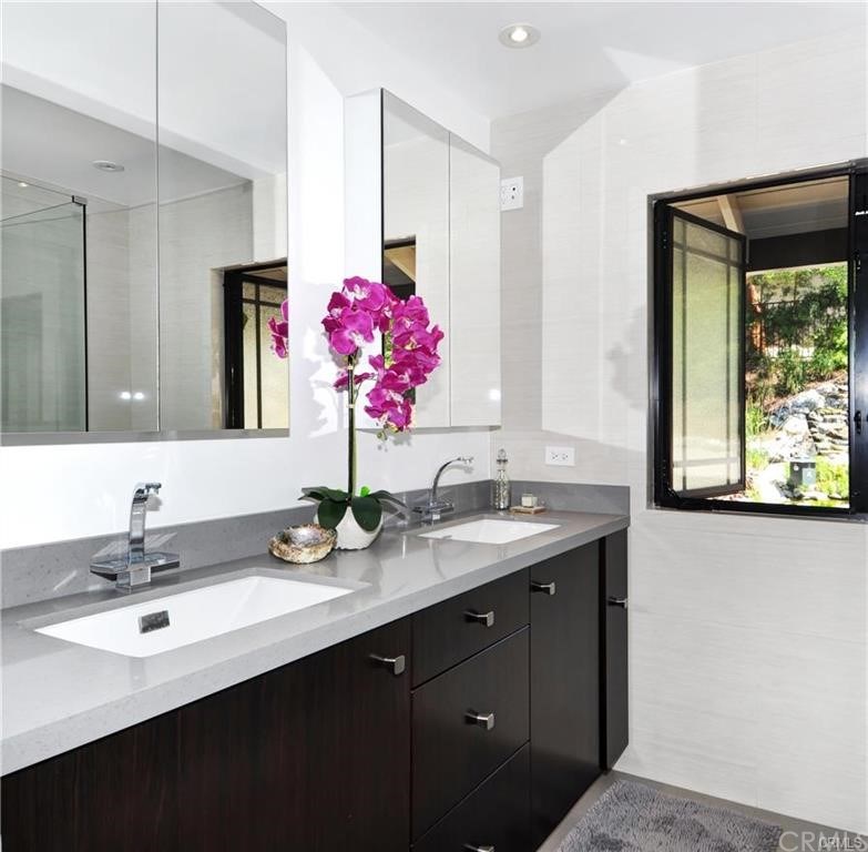32732 Mediterranean Drive Dana Point, CA 92629 - Photo 16 of 24 a bathroom with a sink and a mirror