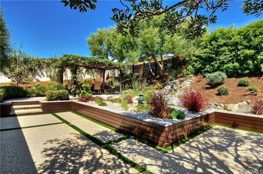 32732 Mediterranean Drive Dana Point, CA 92629 - Photo 20 of 24 a view of a backyard with plants and a patio