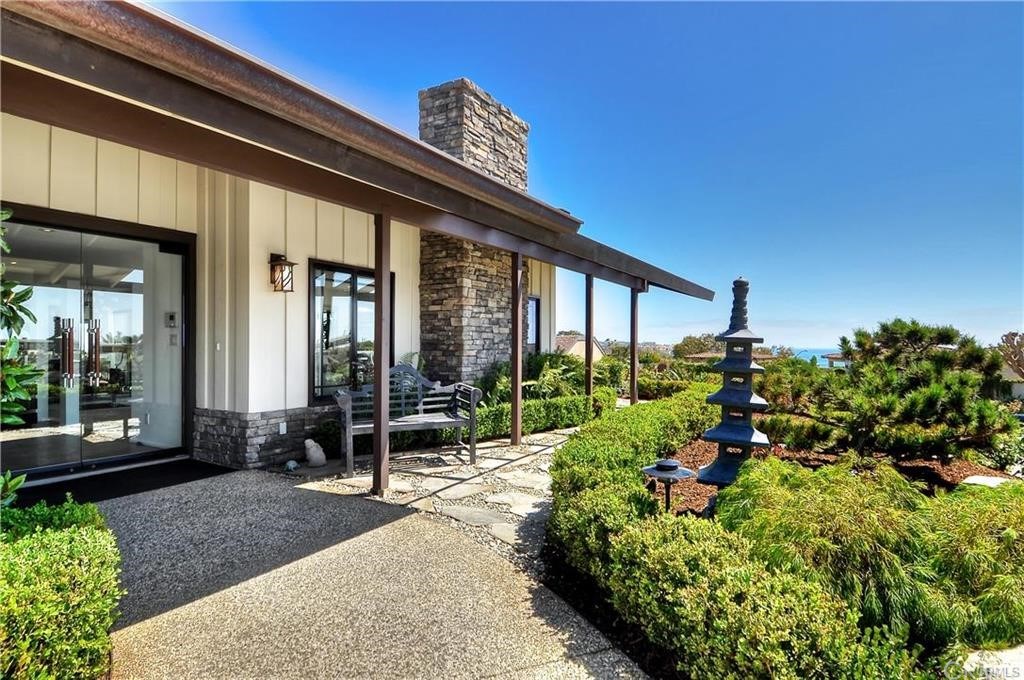 32732 Mediterranean Drive Dana Point, CA 92629 - Photo 2 of 24 a front view of a house with a yard
