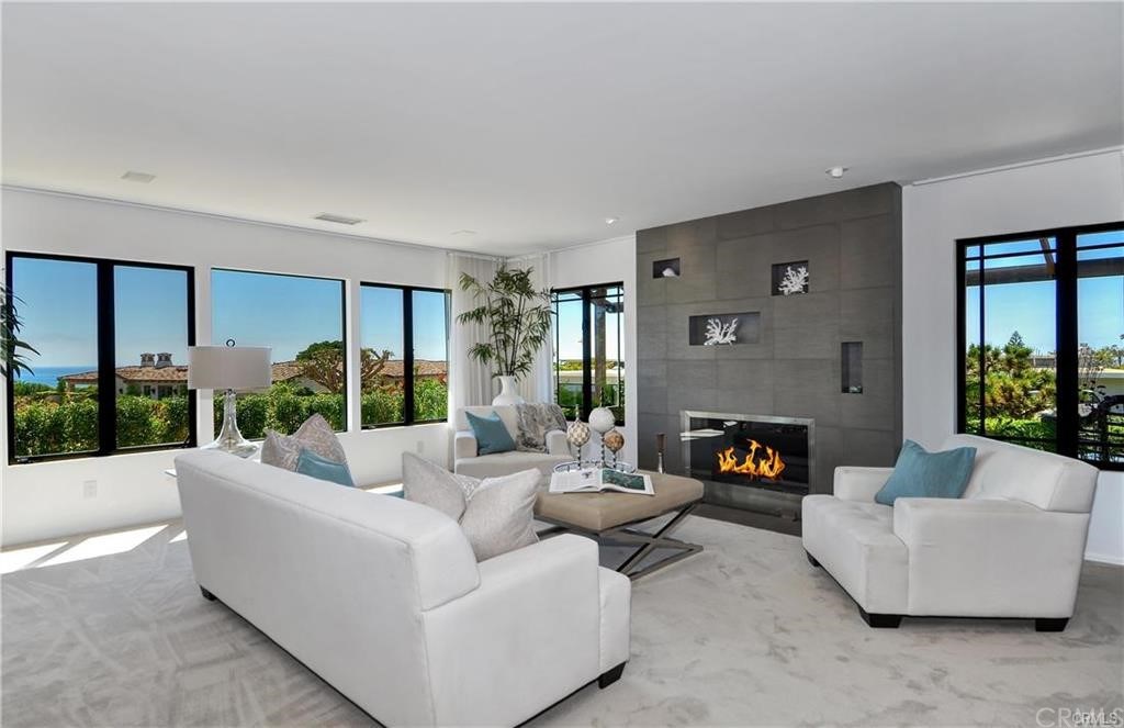 32732 Mediterranean Drive Dana Point, CA 92629 - Photo 3 of 24 a living room with furniture and a fireplace