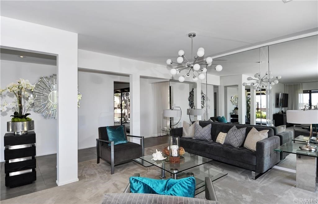 32732 Mediterranean Drive Dana Point, CA 92629 - Photo 6 of 24 a living room with furniture a chandelier and a chandelier