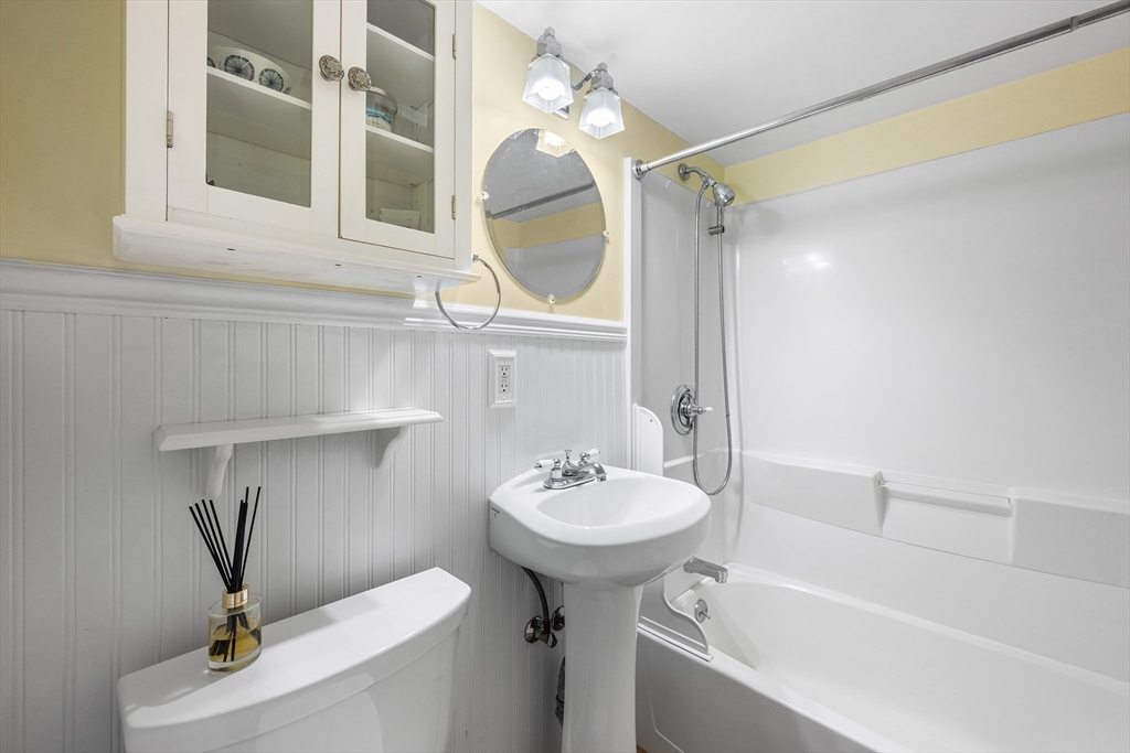 44 East Bare Hill Road Harvard, MA 01451 - Photo 11 of 20 a bathroom with a sink a mirror and a bathtub