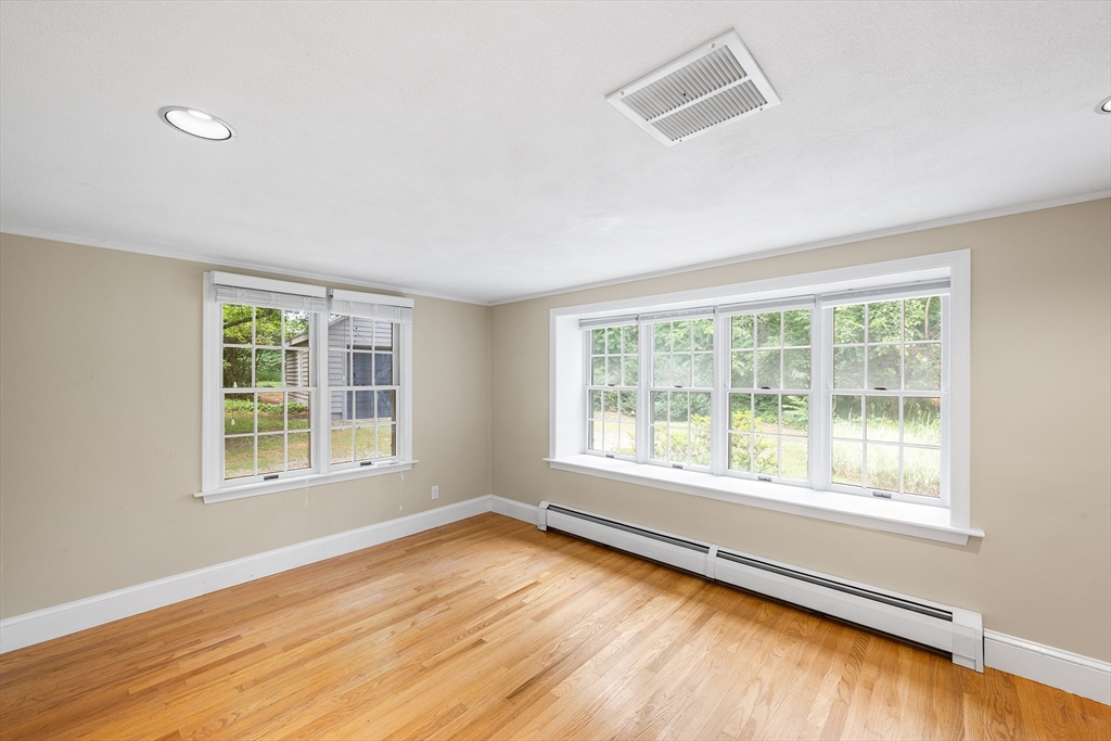 44 East Bare Hill Road Harvard, MA 01451 - Photo 12 of 20 a view of an empty room with wooden floor and a window
