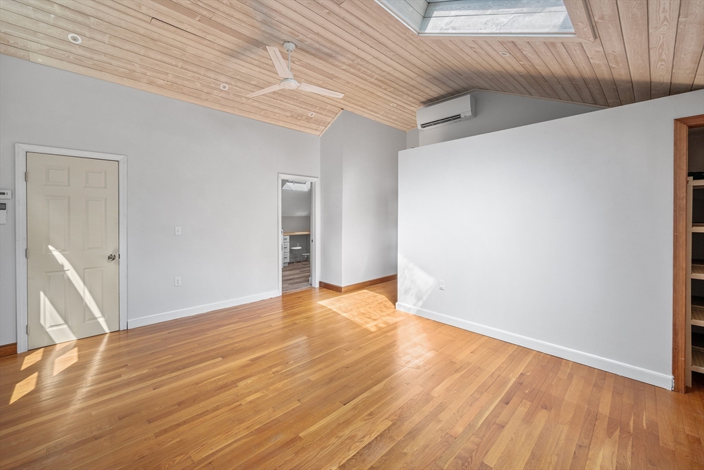 44 East Bare Hill Road Harvard, MA 01451 - Photo 16 of 20 a view of an empty room with wooden floor and a window