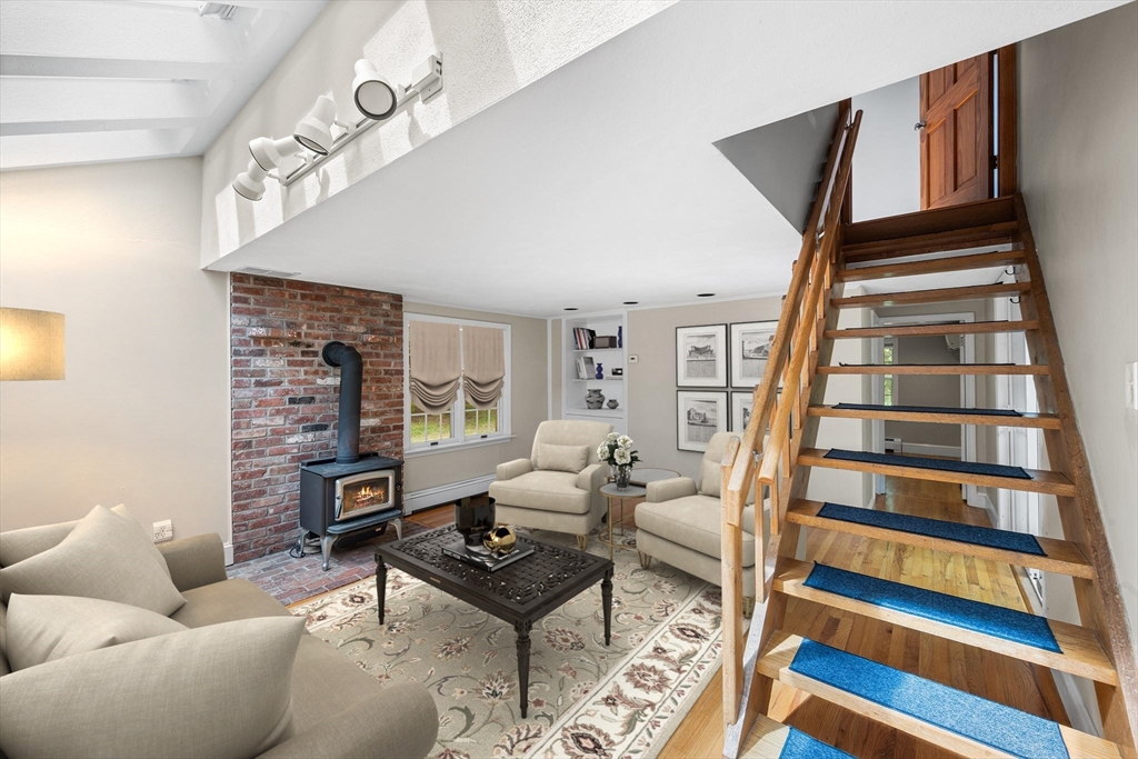 44 East Bare Hill Road Harvard, MA 01451 - Photo 4 of 20 a living room with furniture and a fireplace