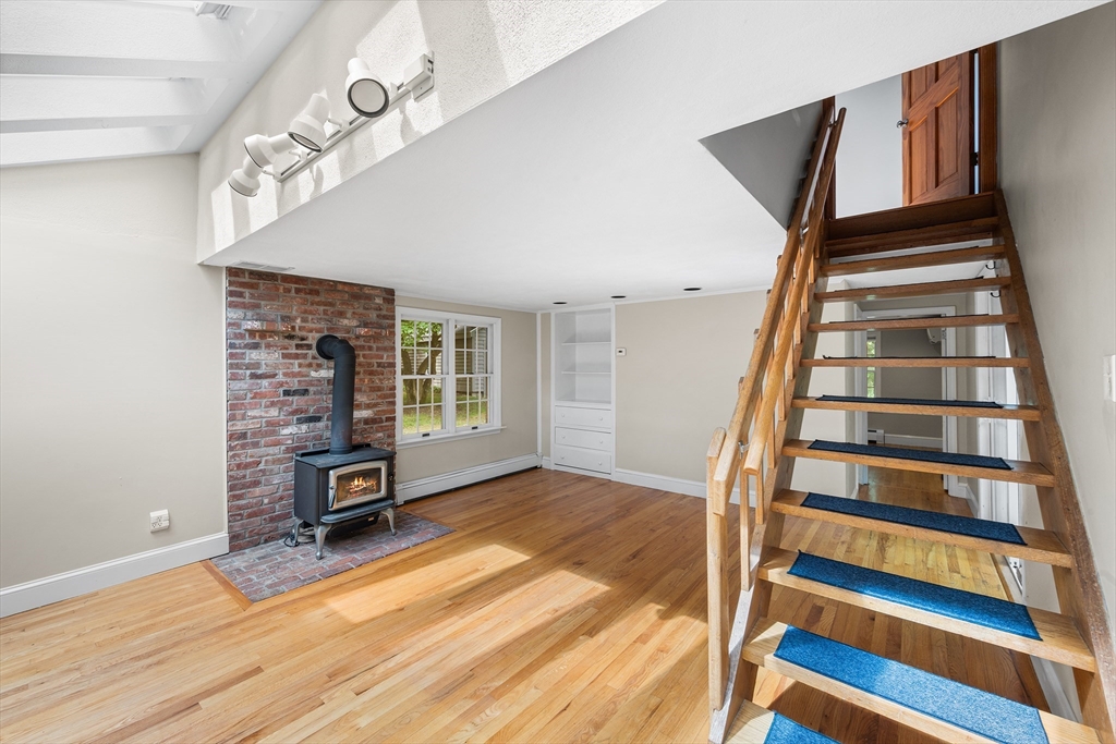 44 East Bare Hill Road Harvard, MA 01451 - Photo 5 of 20 an empty room with wooden floor and windows
