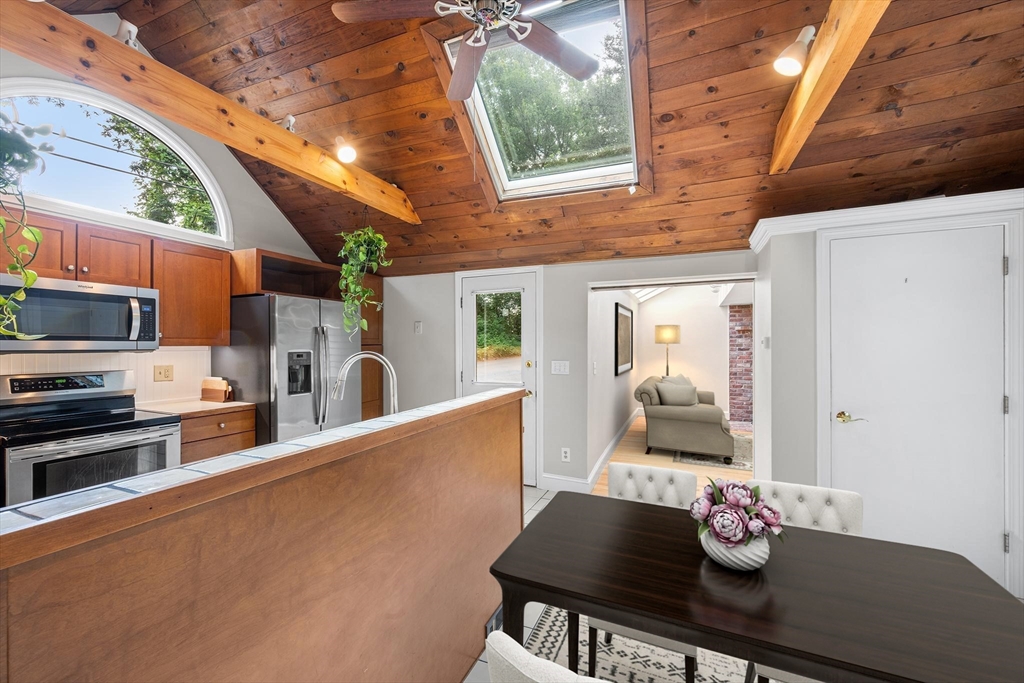 44 East Bare Hill Road Harvard, MA 01451 - Photo 7 of 20 a kitchen with stainless steel appliances granite countertop a stove a sink dishwasher and cabinets with wooden floor