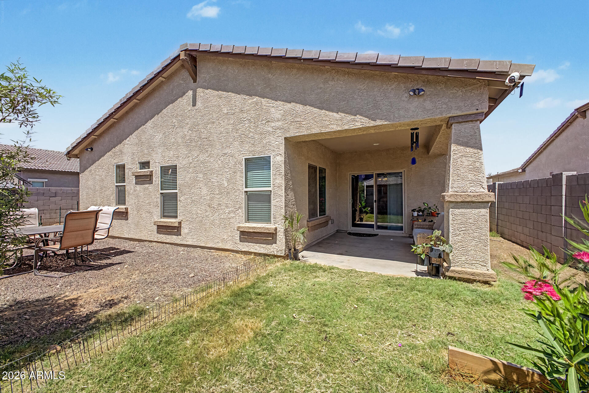 16719 West Rowel Road Surprise, AZ 85387 - Photo 22 of 28 a view of a house with backyard and sitting area