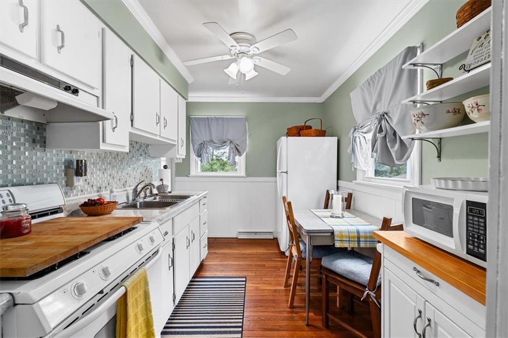 1038 Summit Avenue Monaca, PA 15061 - Photo 12 of 23 a kitchen with cabinets and wooden floor