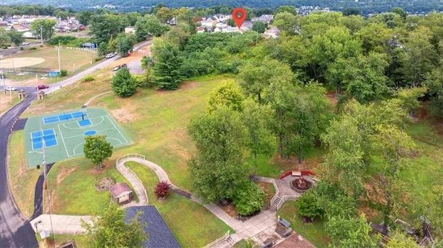 a backyard of a house with lots of green space and plants