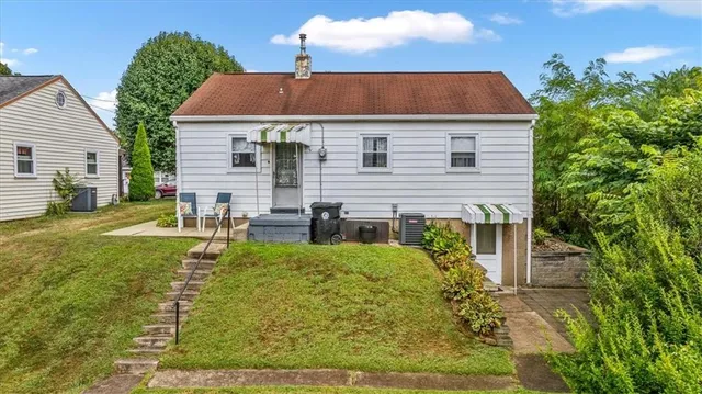 a aerial view of a house with swimming pool