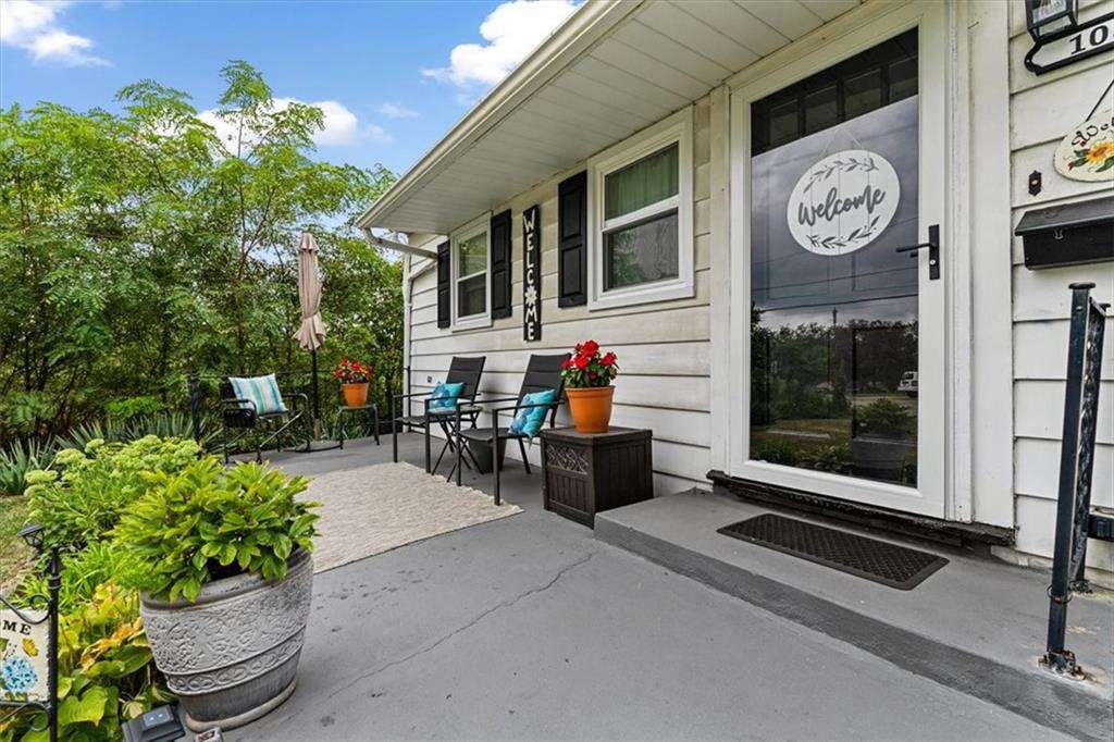 1038 Summit Avenue Monaca, PA 15061 - Photo 6 of 23 a view of a dinning room with a bench and a potted plant