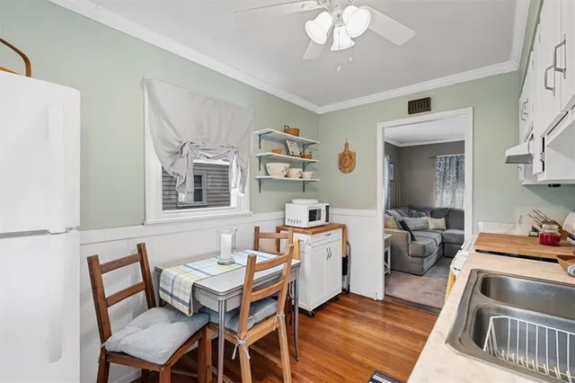 a living room with fireplace furniture and a wooden floor