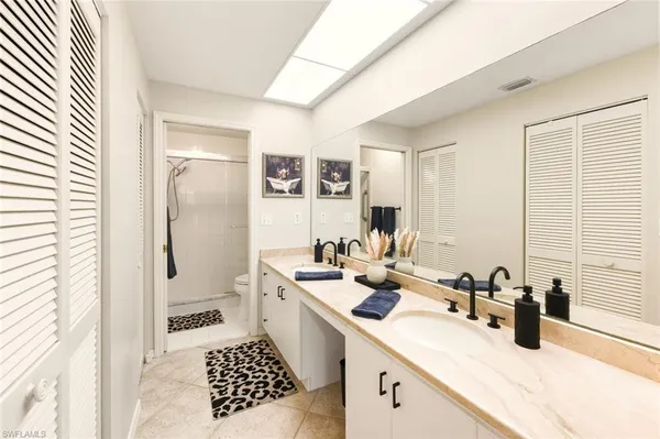 a bathroom with a shower and a shower