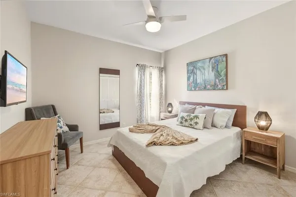 a bed room with a bed and a dresser