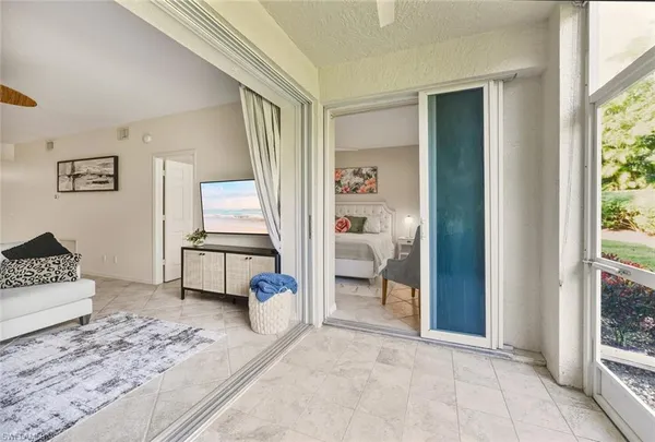 a living room with furniture and a rug