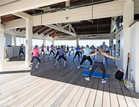 a view of a room with gym equipment and lots of equipment