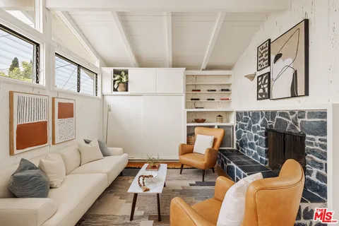 a living room with furniture and a table