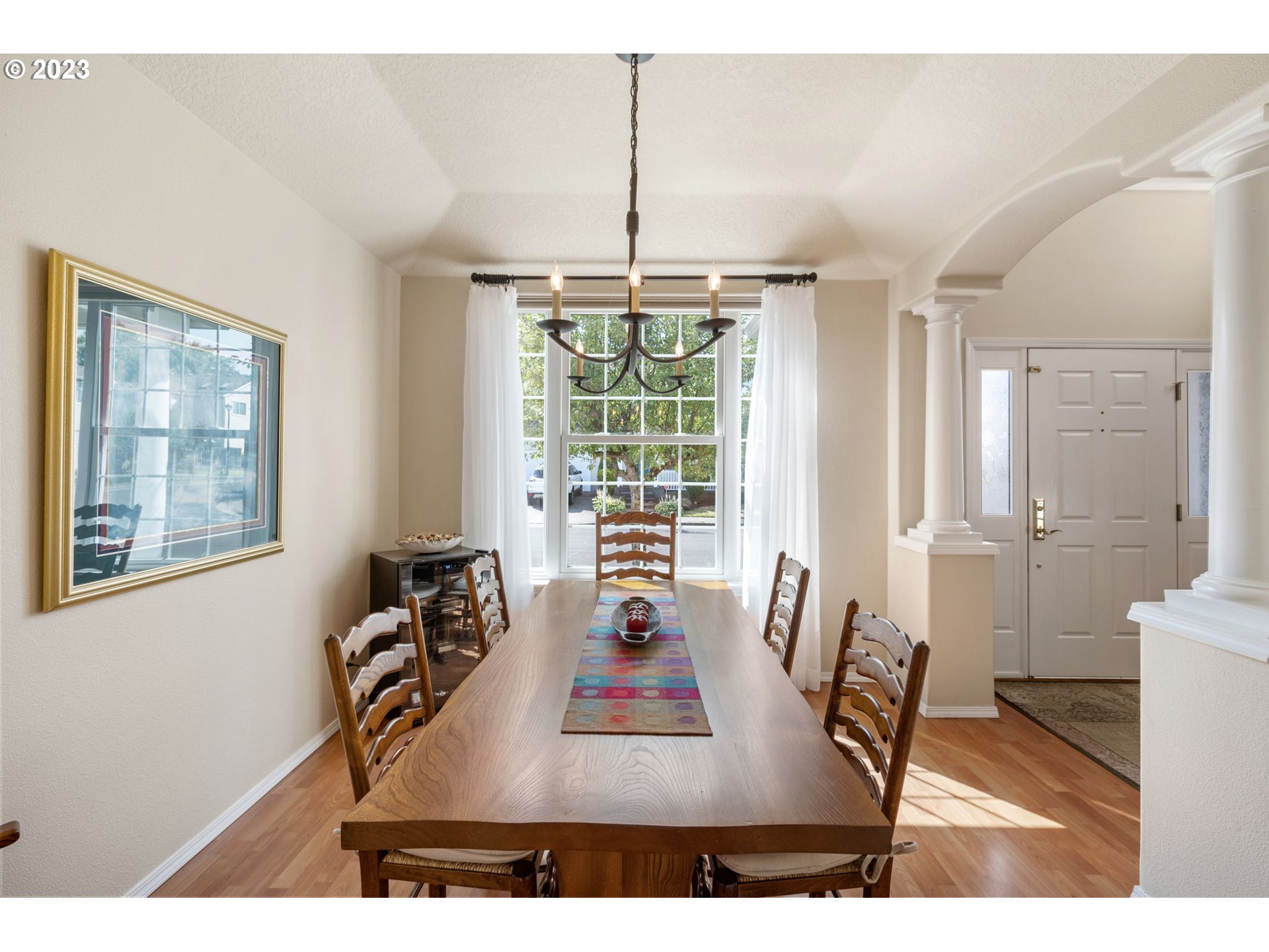 8627 Southwest Lodi Lane Portland, OR 97224 - Photo 13 of 41 a view of a dining room with furniture window and outside view