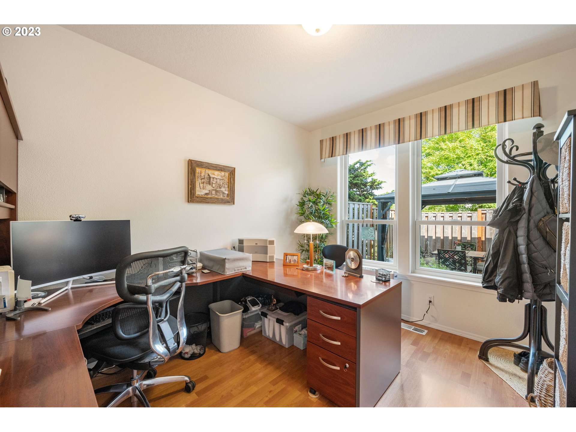 8627 Southwest Lodi Lane Portland, OR 97224 - Photo 16 of 41 a view of a workspace with furniture and a window
