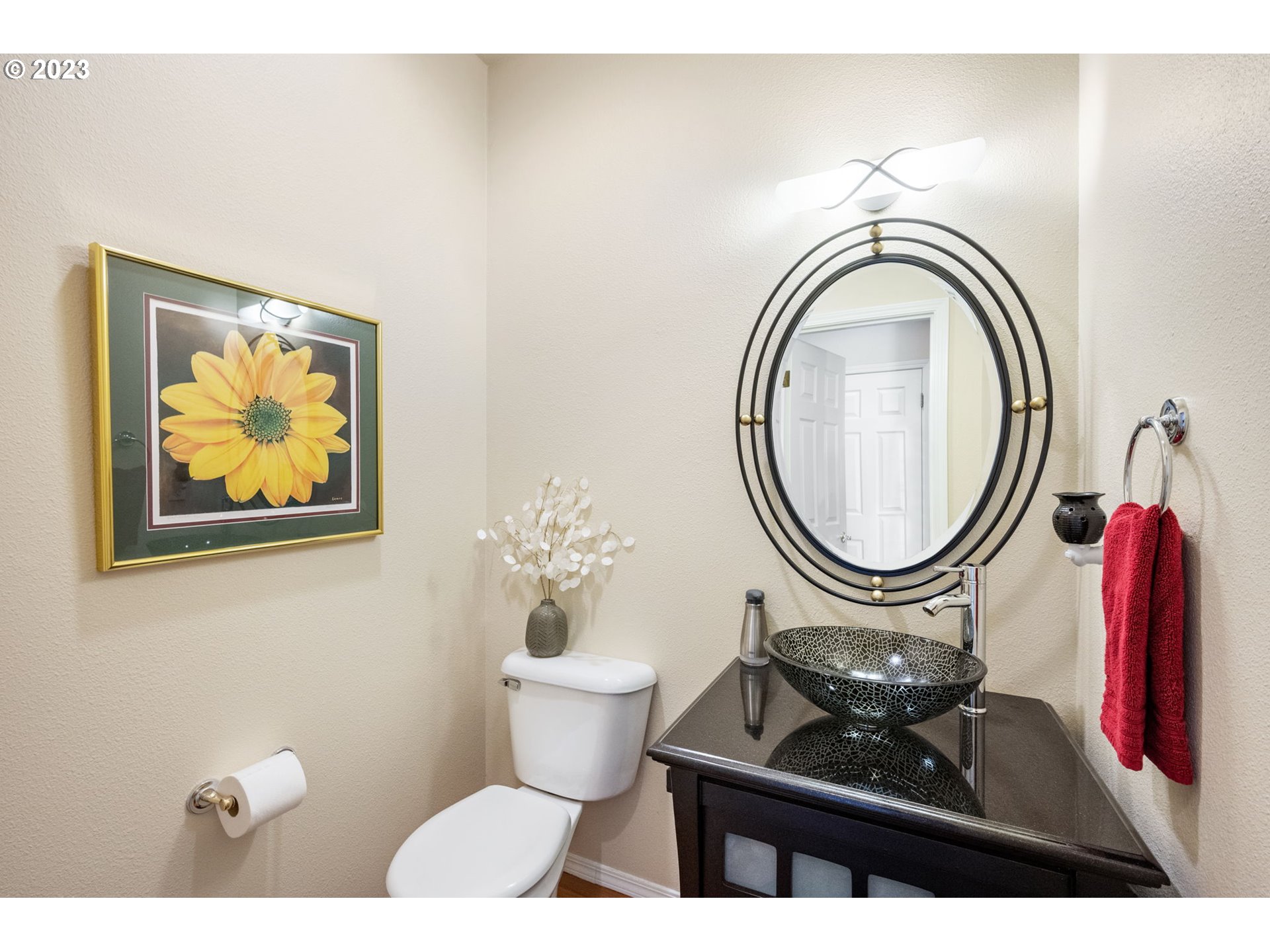8627 Southwest Lodi Lane Portland, OR 97224 - Photo 17 of 41 a bathroom with a toilet a sink and a mirror