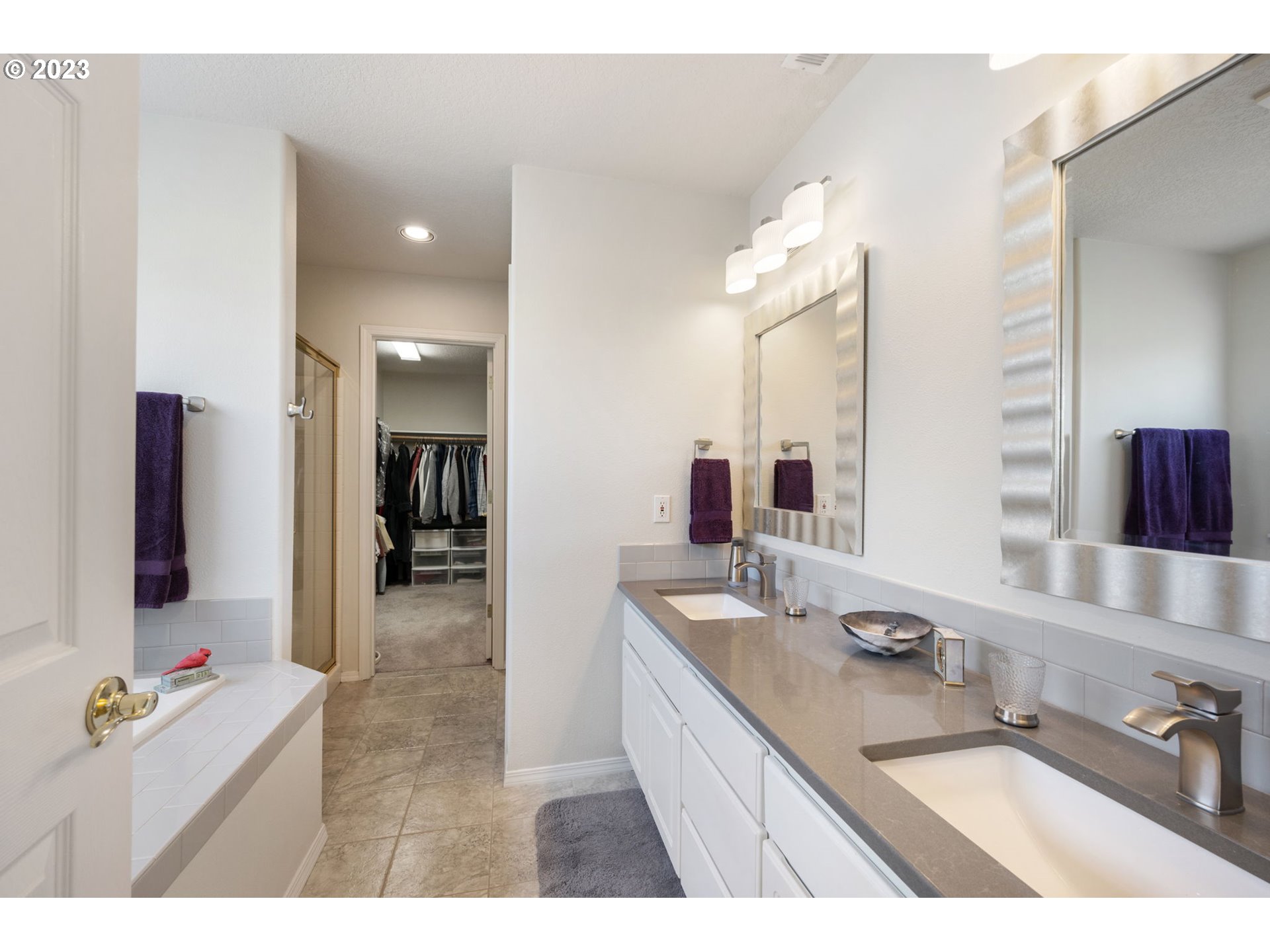 8627 Southwest Lodi Lane Portland, OR 97224 - Photo 23 of 41 a bathroom with a sink double vanity granite and a mirror