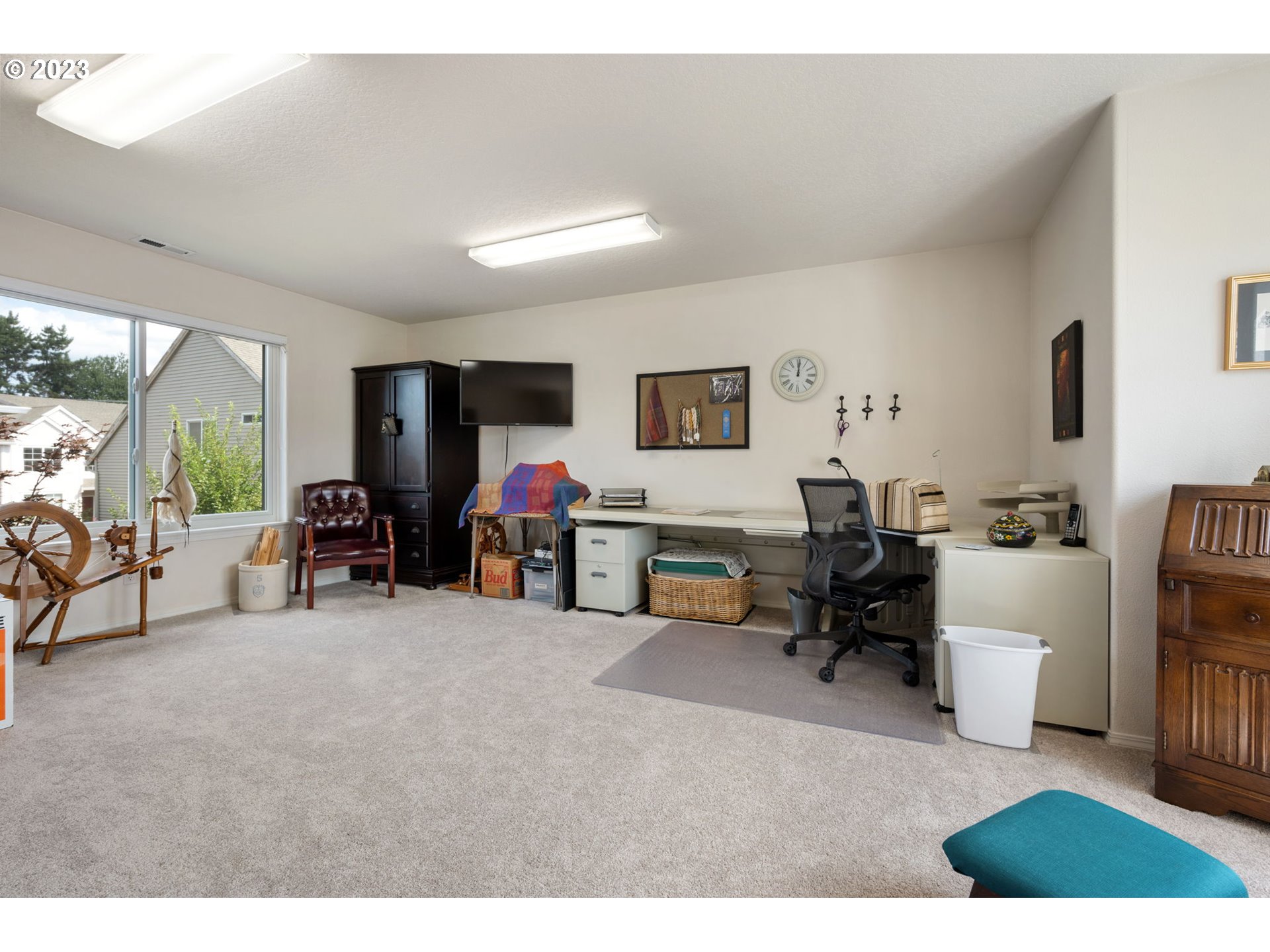 8627 Southwest Lodi Lane Portland, OR 97224 - Photo 28 of 41 a living room with furniture and a large window
