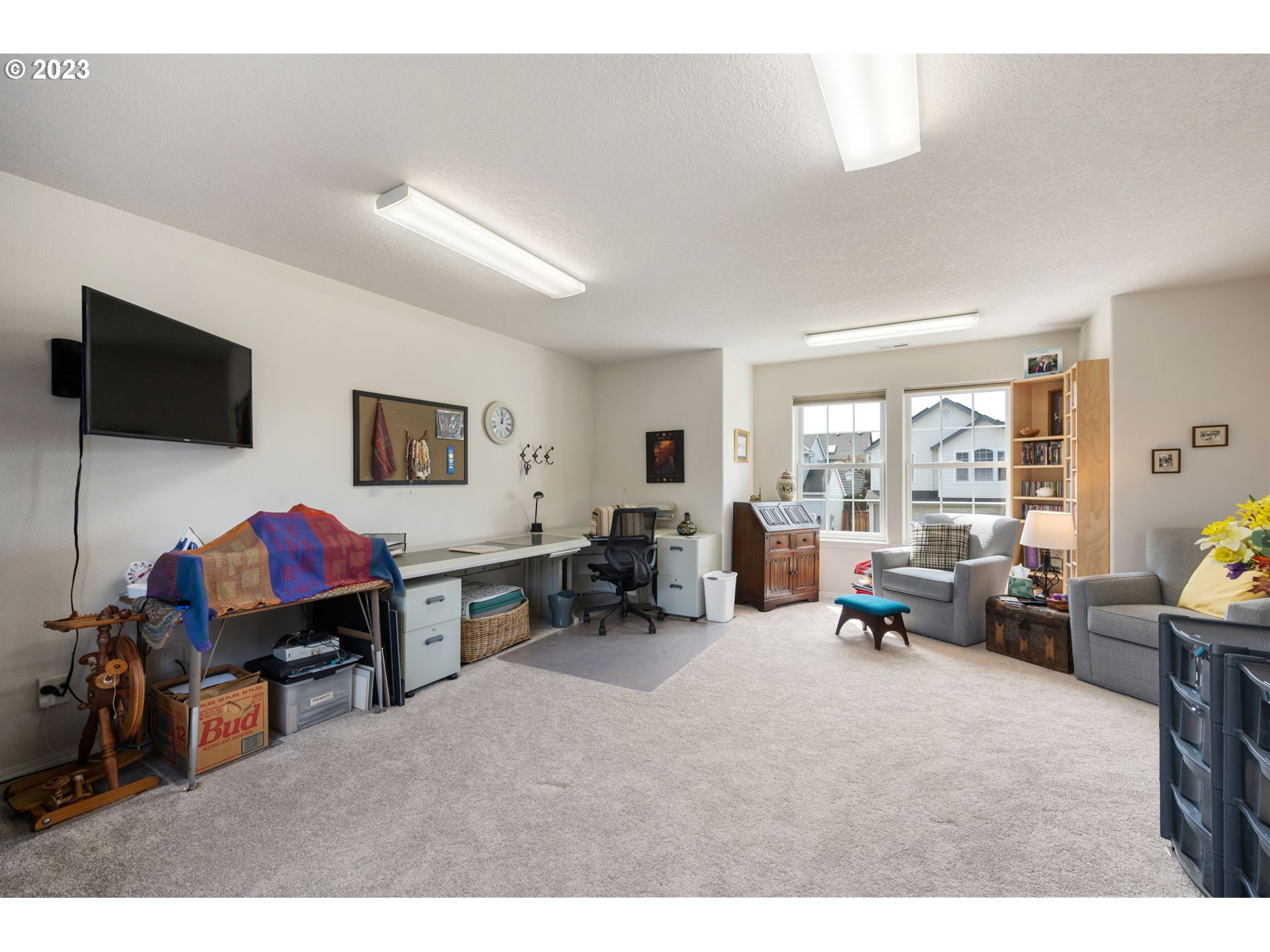 8627 Southwest Lodi Lane Portland, OR 97224 - Photo 29 of 41 a living room with furniture and a flat screen tv