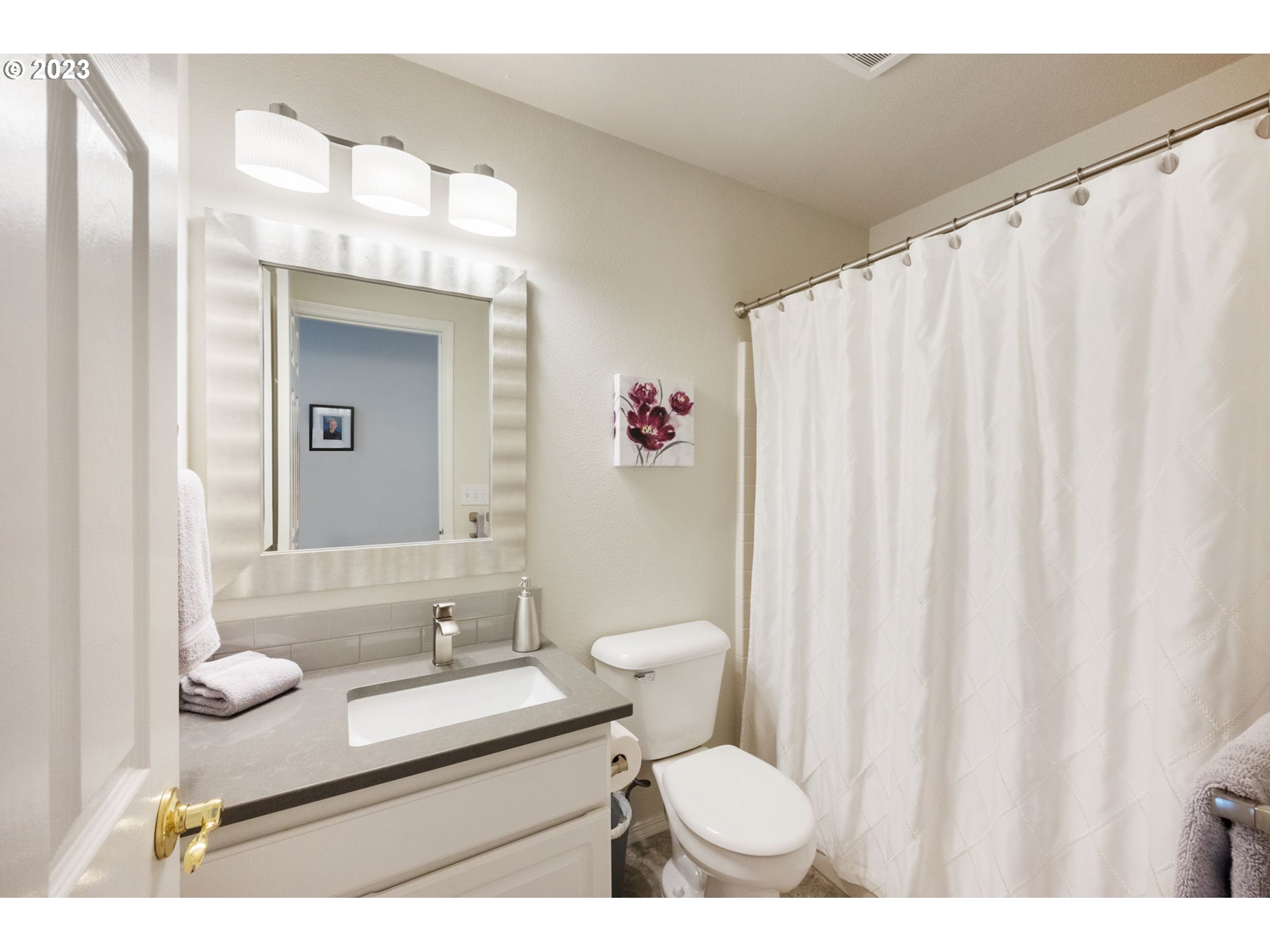 8627 Southwest Lodi Lane Portland, OR 97224 - Photo 30 of 41 a bathroom with a sink toilet and shower
