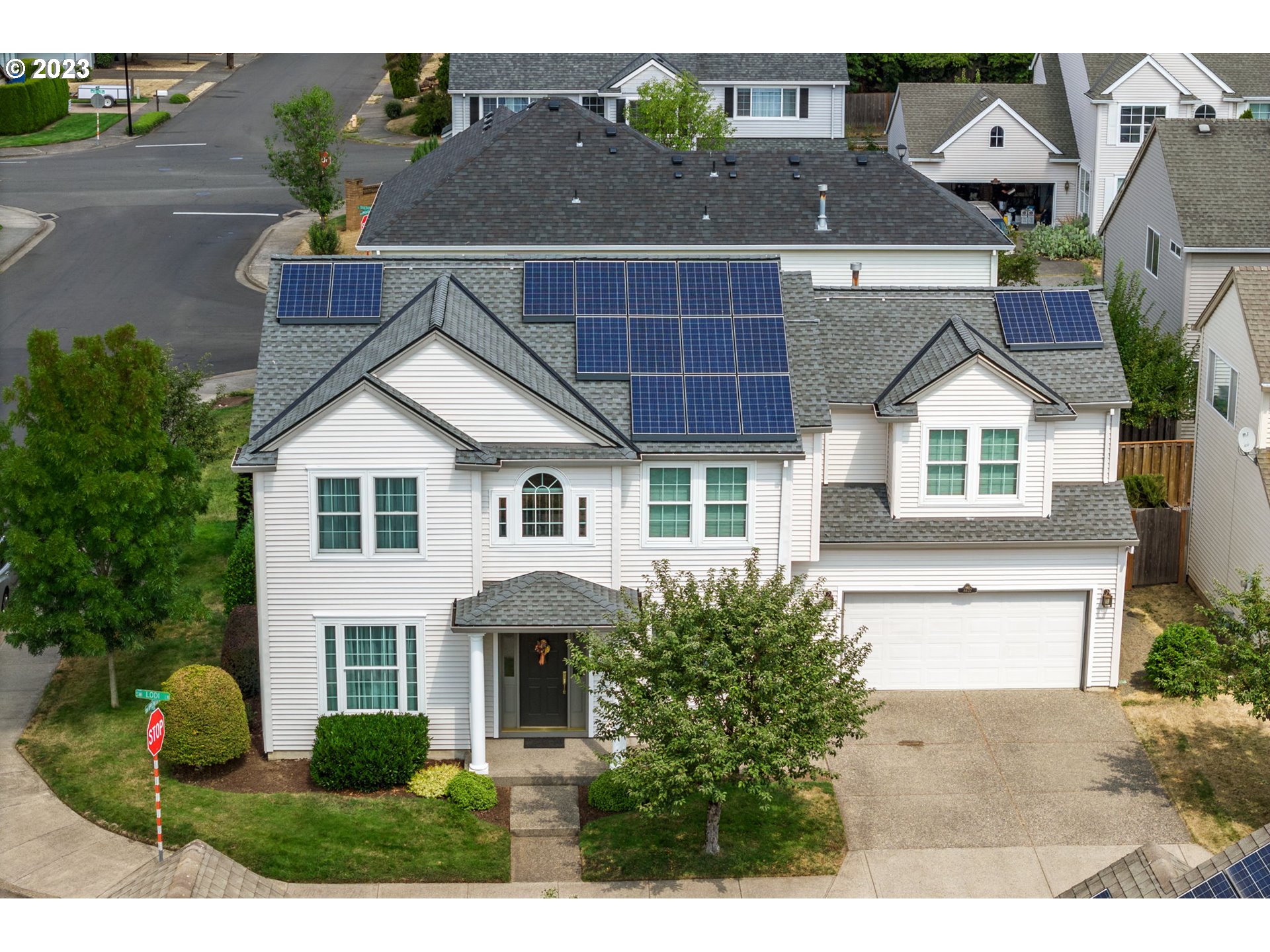 8627 Southwest Lodi Lane Portland, OR 97224 - Photo 3 of 41 a view of house with yard