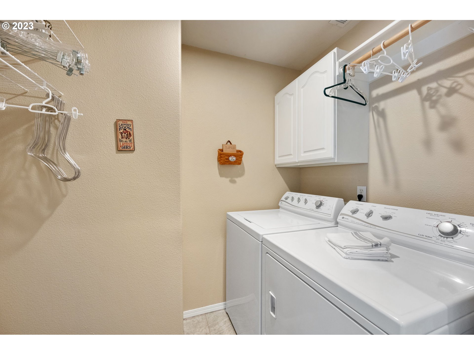 8627 Southwest Lodi Lane Portland, OR 97224 - Photo 33 of 41 a utility room with a sink dryer and washer