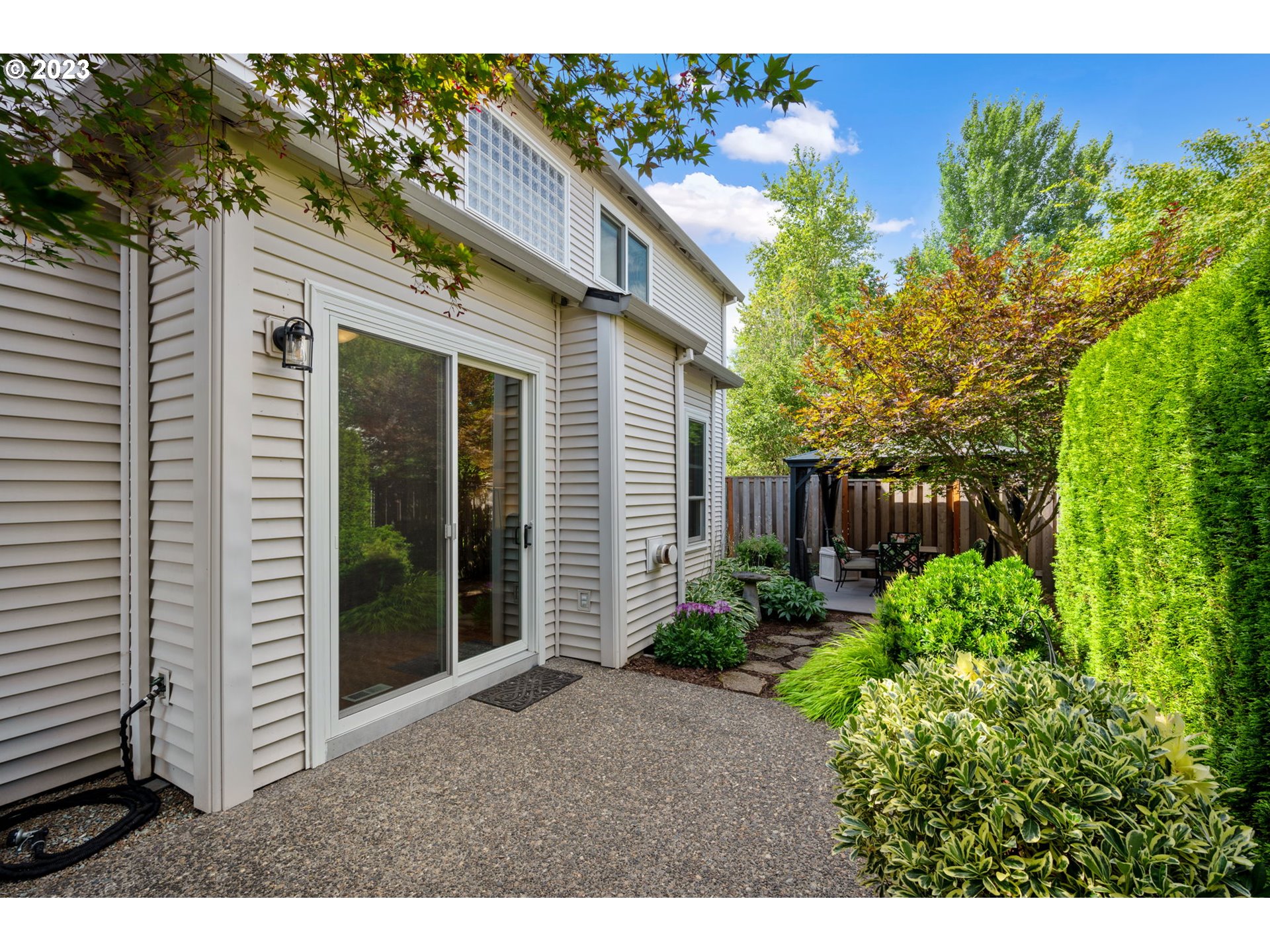 8627 Southwest Lodi Lane Portland, OR 97224 - Photo 34 of 41 a view of a house with a flower garden