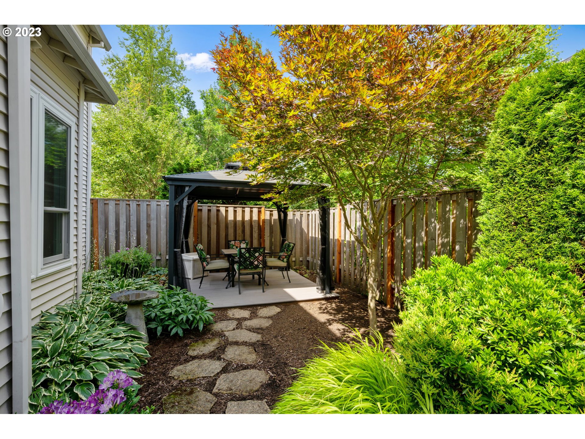 8627 Southwest Lodi Lane Portland, OR 97224 - Photo 35 of 41 a garden view with a seating space