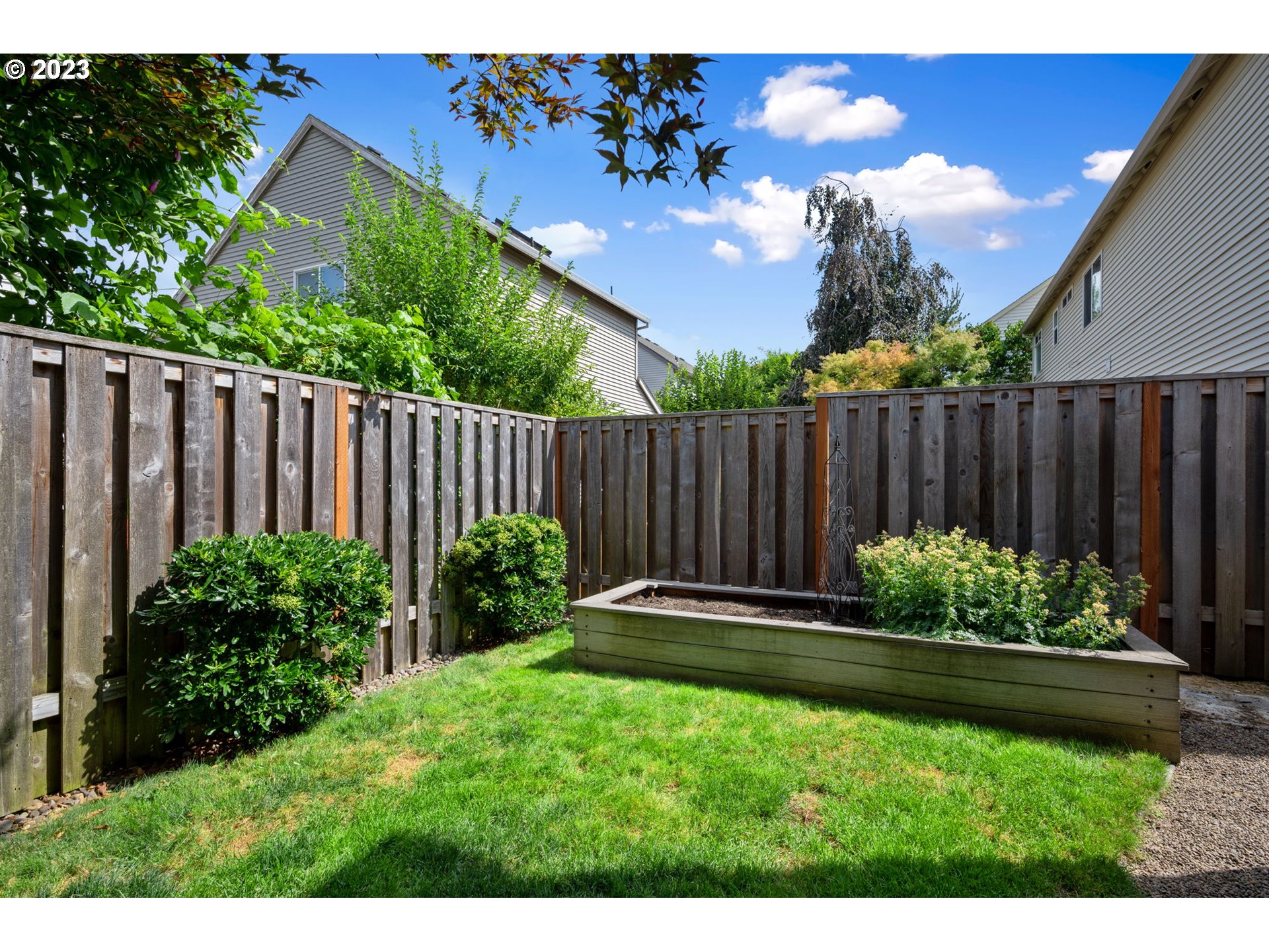 8627 Southwest Lodi Lane Portland, OR 97224 - Photo 38 of 41 a garden with wooden fence