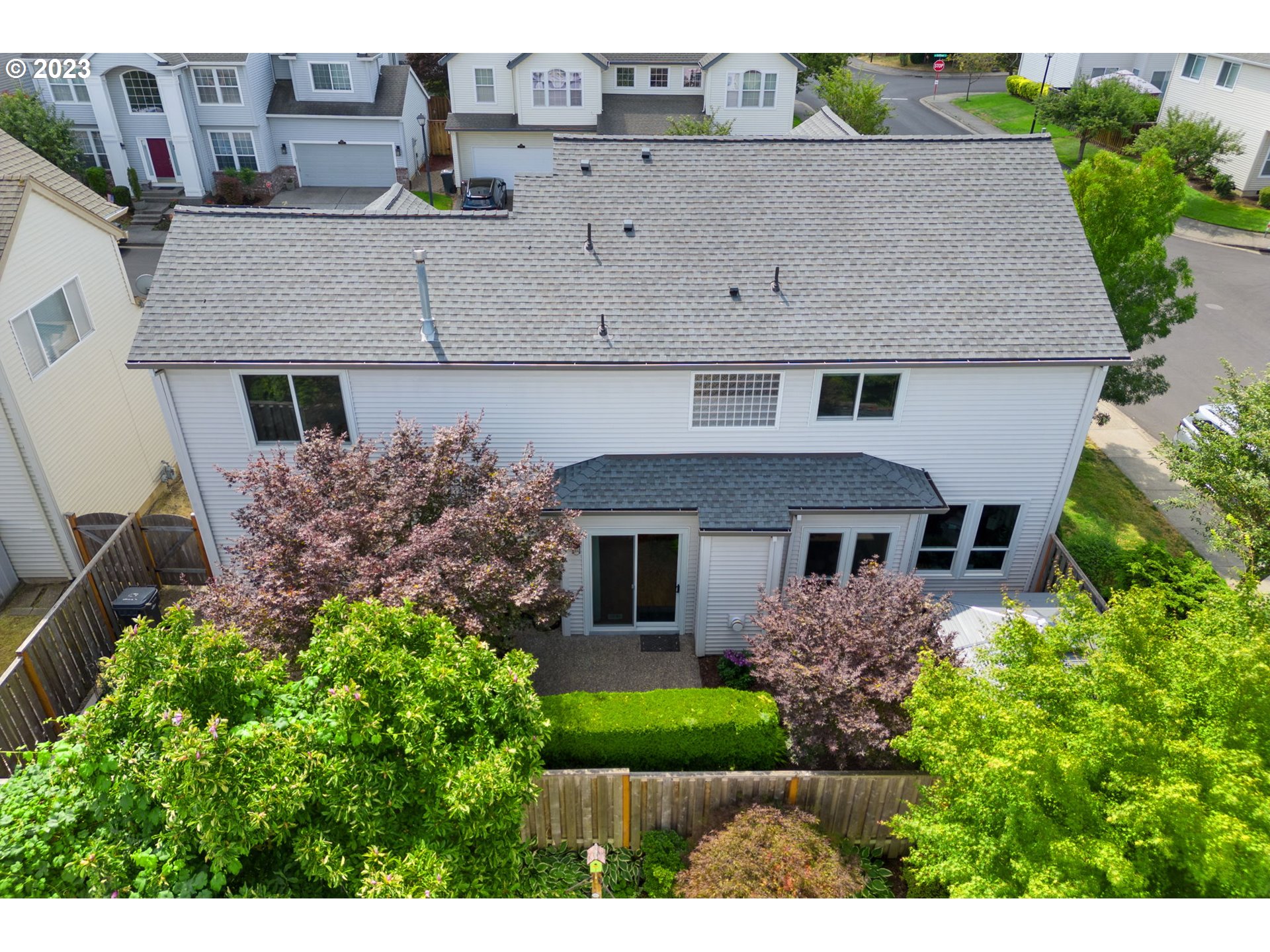 8627 Southwest Lodi Lane Portland, OR 97224 - Photo 40 of 41 a aerial view of a house with a yard and potted plants