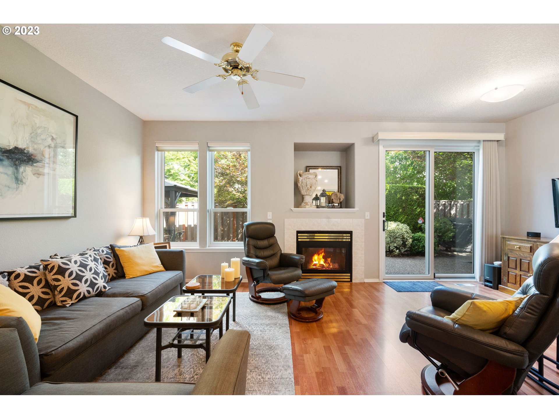8627 Southwest Lodi Lane Portland, OR 97224 - Photo 7 of 41 a living room with furniture and a fireplace